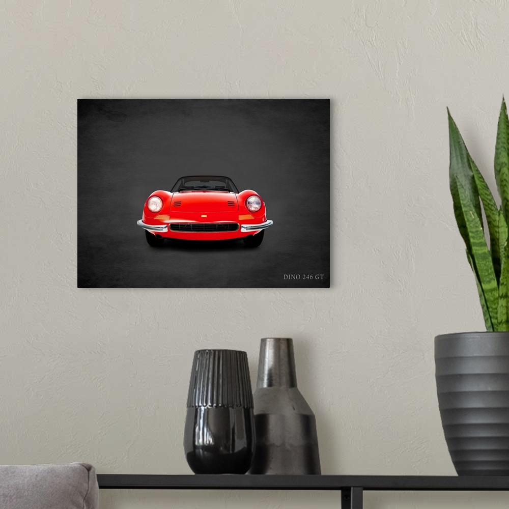 A modern room featuring Photograph of a red 1969 Ferrari Dino 246GT printed on a black background with a dark vignette.