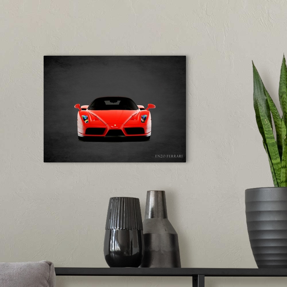 A modern room featuring Photograph of a red Ferrari Enzo printed on a black background with a dark vignette.