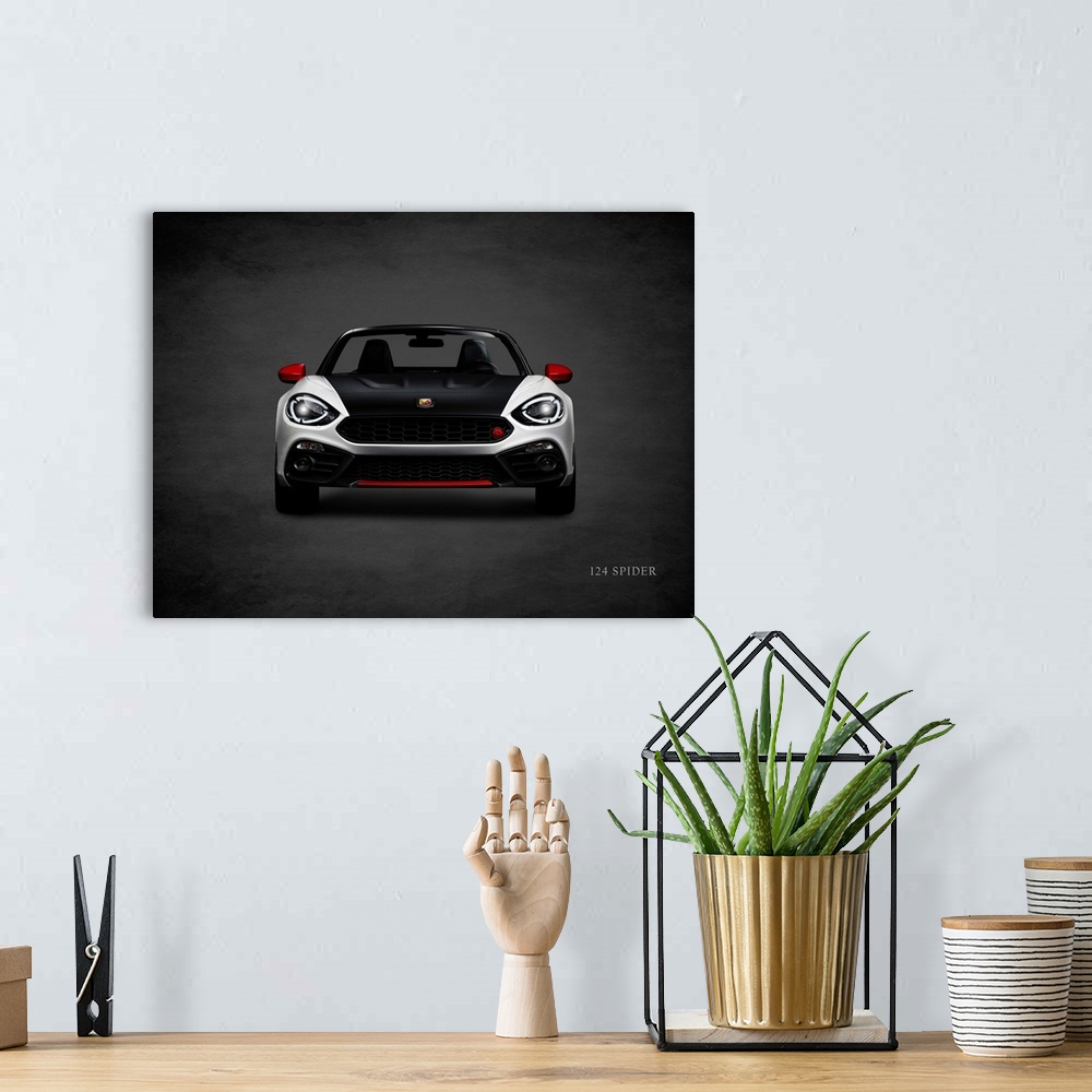 A bohemian room featuring Photograph of a silver, black, and red Fiat 124 Spider printed on a black background with a dark ...