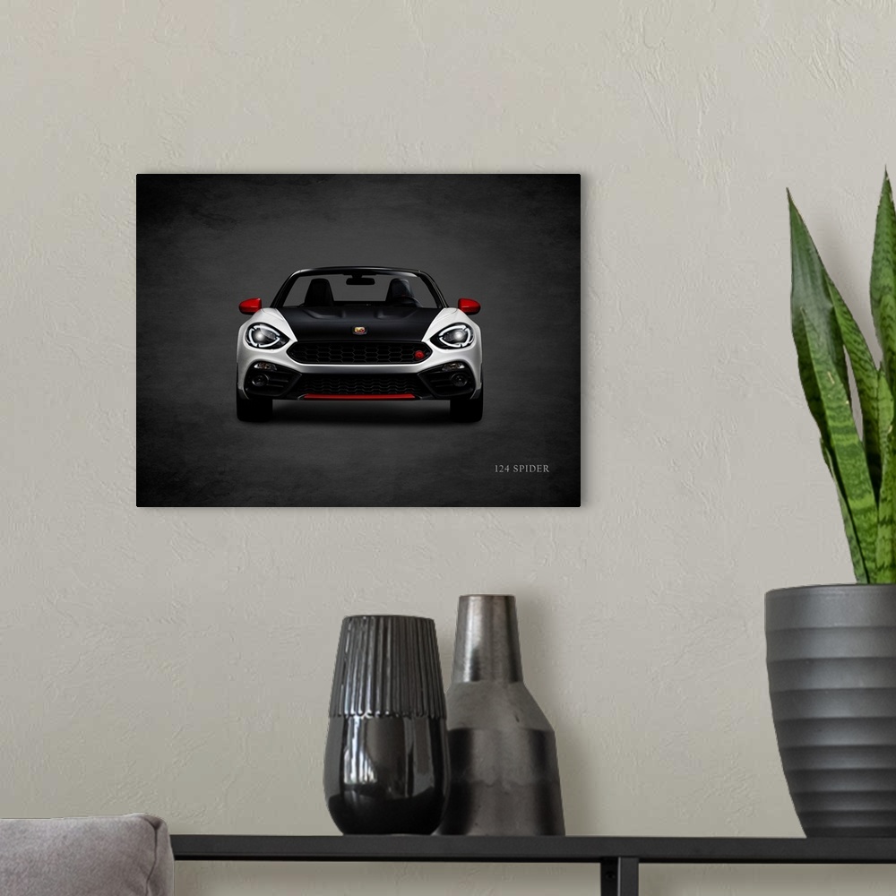 A modern room featuring Photograph of a silver, black, and red Fiat 124 Spider printed on a black background with a dark ...