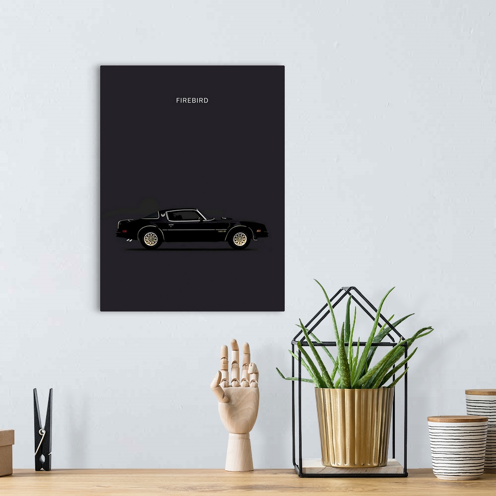 A bohemian room featuring Photograph of a black and gold Firebird 78 printed on a black background
