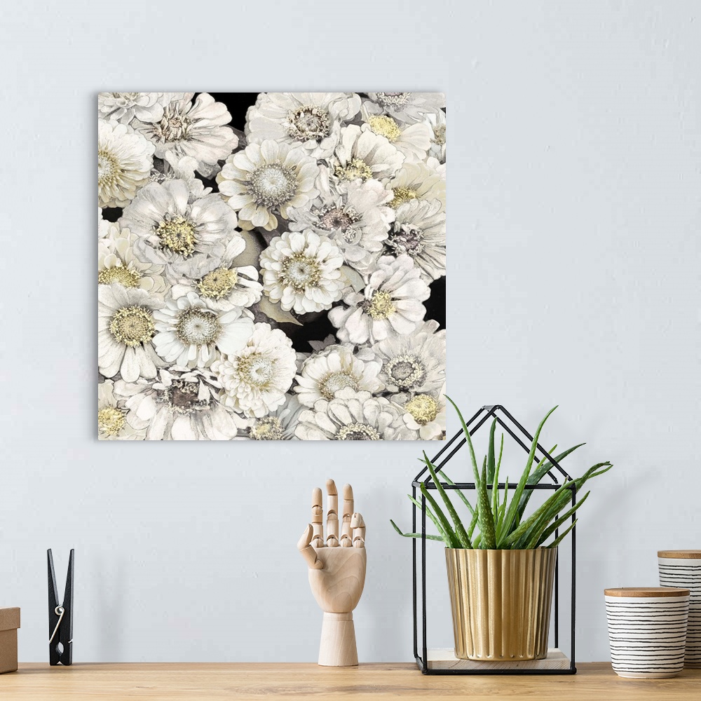 A bohemian room featuring Decorative artwork featuring soft white flowers over a black background.
