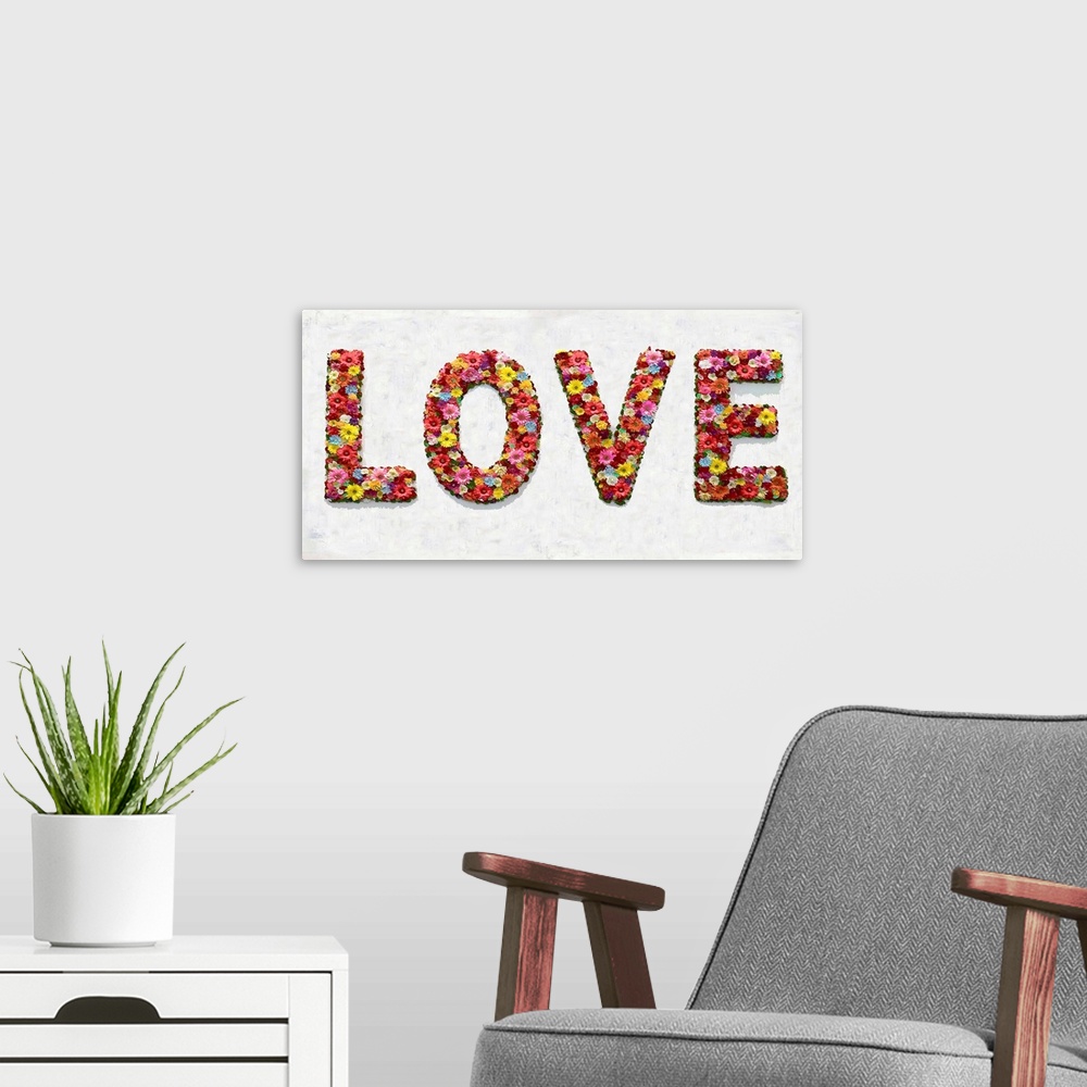 A modern room featuring The word love is shaped by an assortment of colorful flowers.