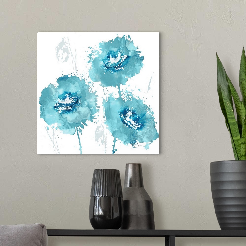 A modern room featuring Square decor with three paint splattered flowers in shades of blue.