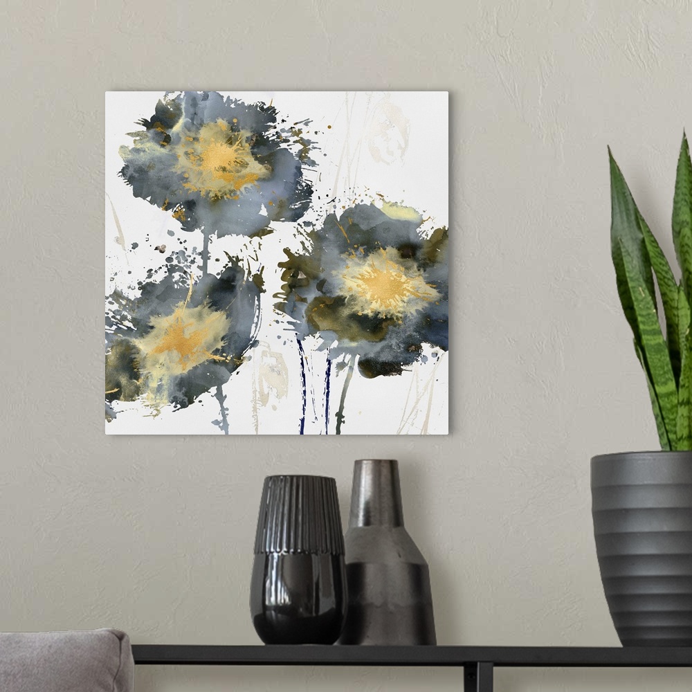 A modern room featuring Square decor with three paint splattered flowers in gold, silver, and blue hues.