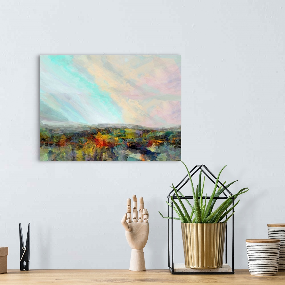 A bohemian room featuring Abstract artwork with a colorful hilly landscape and a pastel sky.
