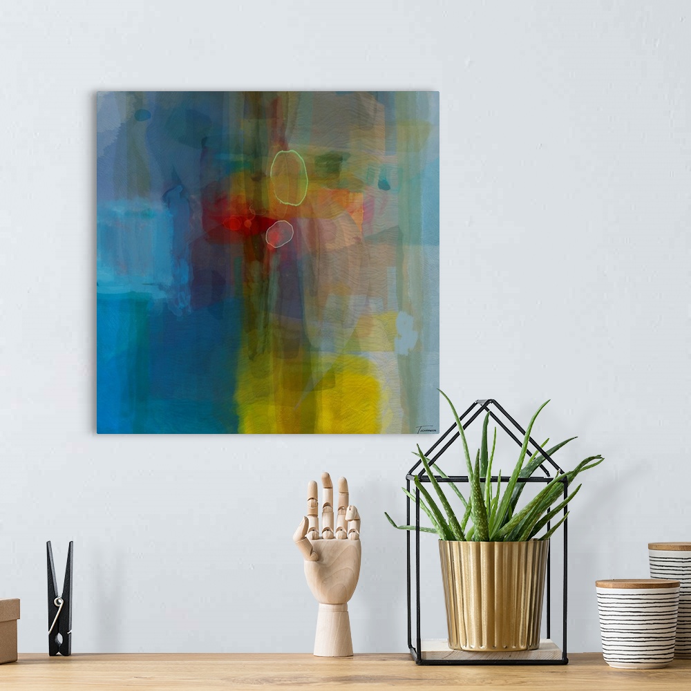 A bohemian room featuring Square abstract art in blue, red, yellow, purple, and green hues.