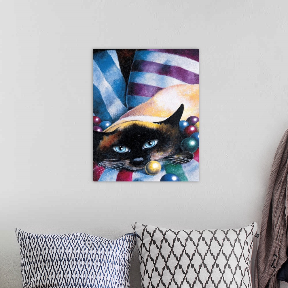 A bohemian room featuring Painting of a cat with a blanket draped over its body and part of its head with colorful balls su...