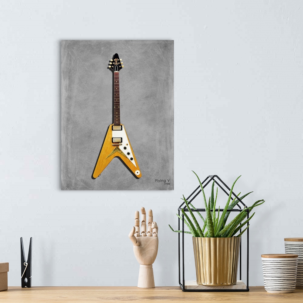 A bohemian room featuring Photograph of a Gibson FlyingV 58 printed on a textured background in shades of gray.