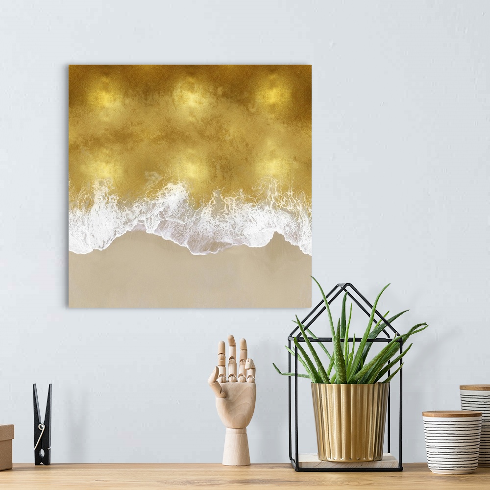 A bohemian room featuring One artwork in a series of aerial shots of a beach as gold waves break upon the shore.