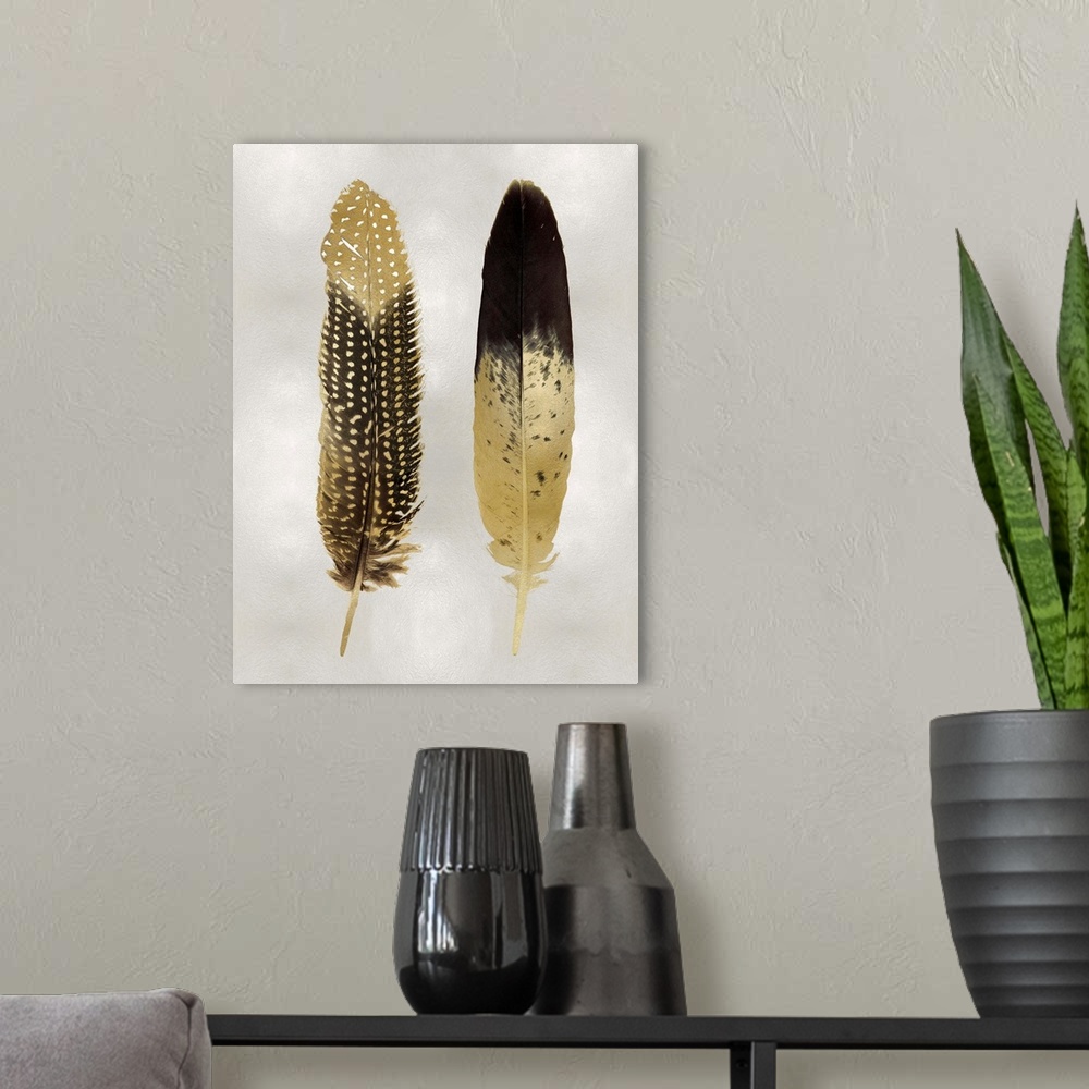 A modern room featuring Illustration of two black and metallic gold feathers on a shiny silver background.