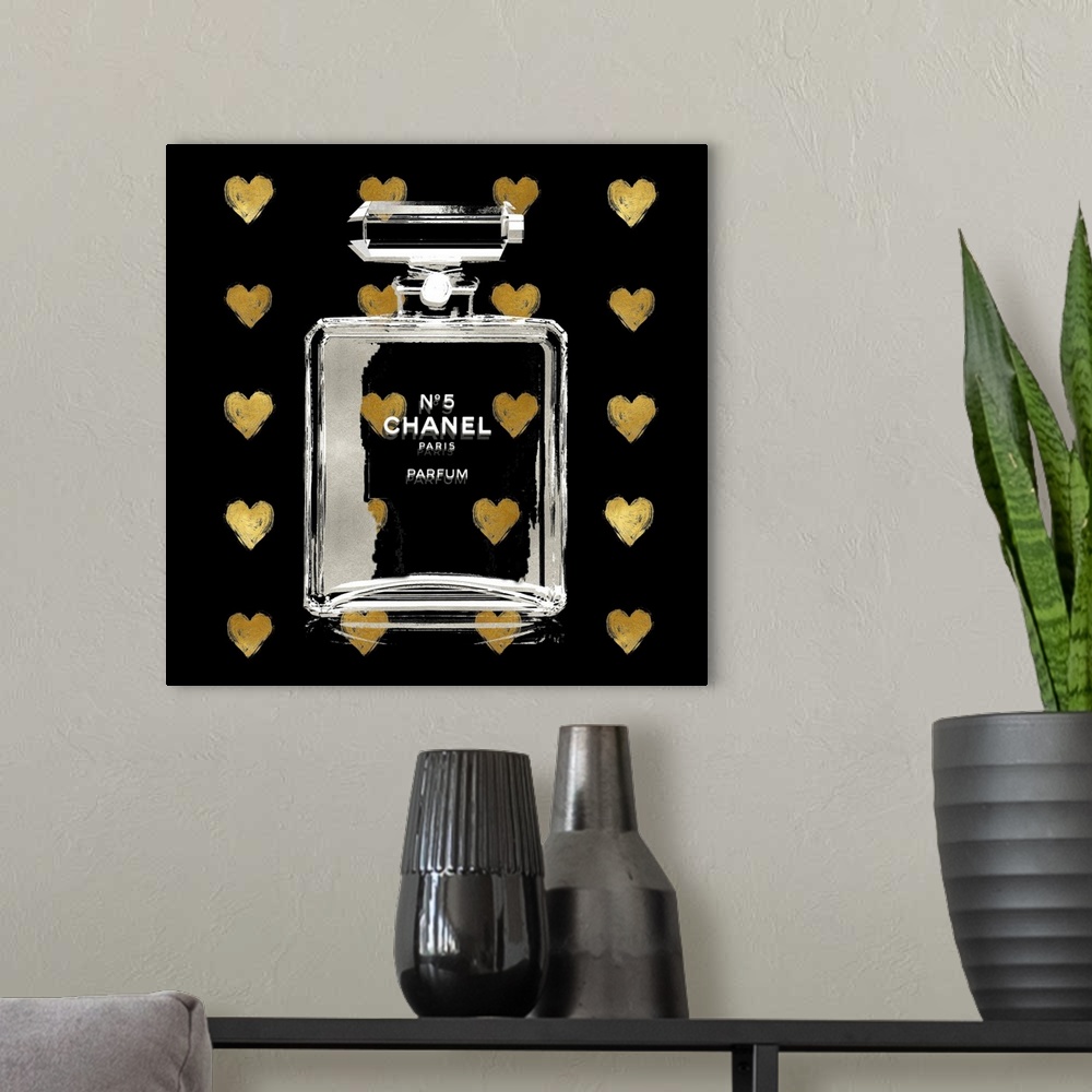 A modern room featuring A black background with hearts peek through a transparent bottle of perfume.