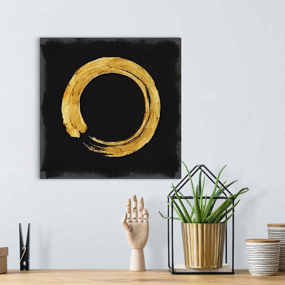 A bohemian room featuring This Zen artwork features a sweeping circular brush stroke in gold over a black background with m...