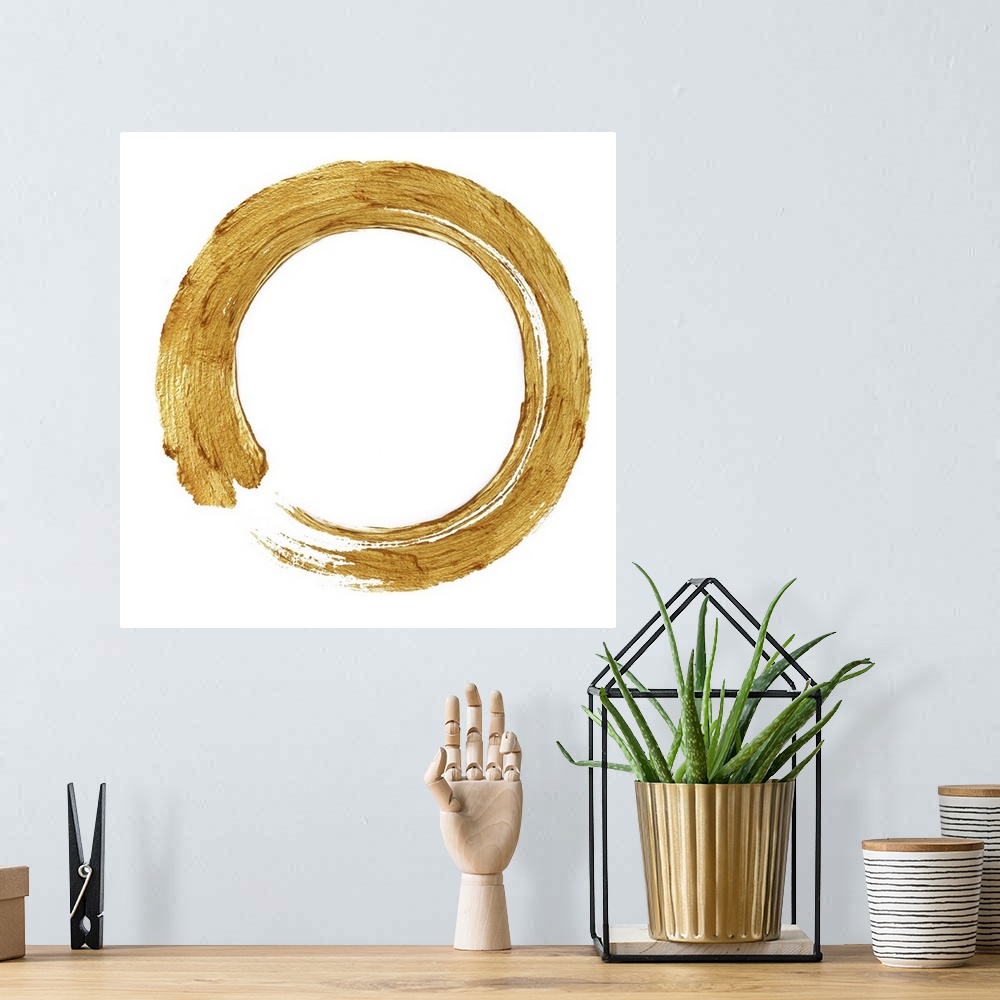A bohemian room featuring This Zen artwork features a sweeping circular brush stroke in gold over a white background.