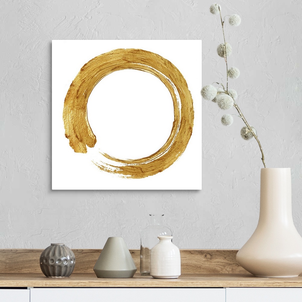 A farmhouse room featuring This Zen artwork features a sweeping circular brush stroke in gold over a white background.