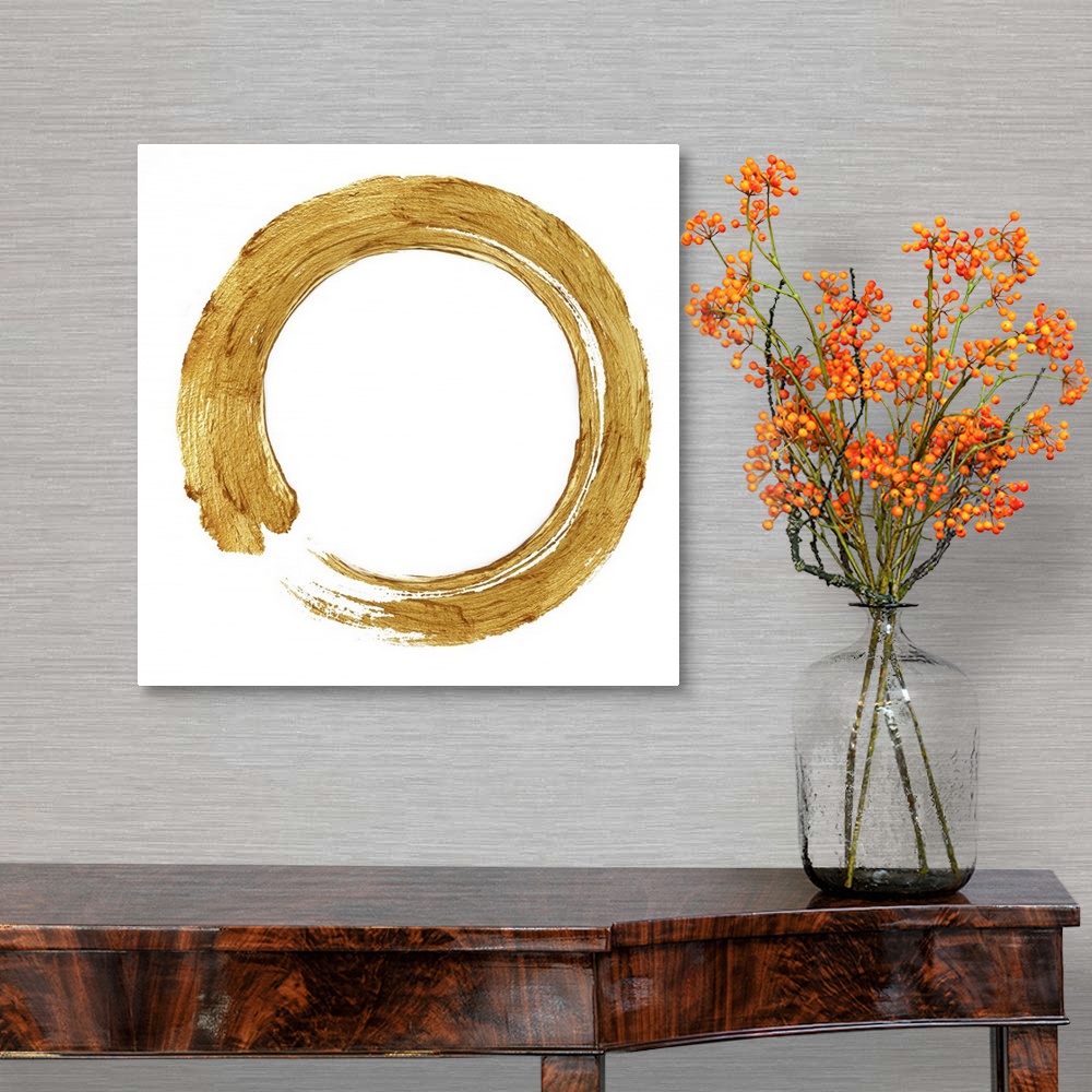 A traditional room featuring This Zen artwork features a sweeping circular brush stroke in gold over a white background.