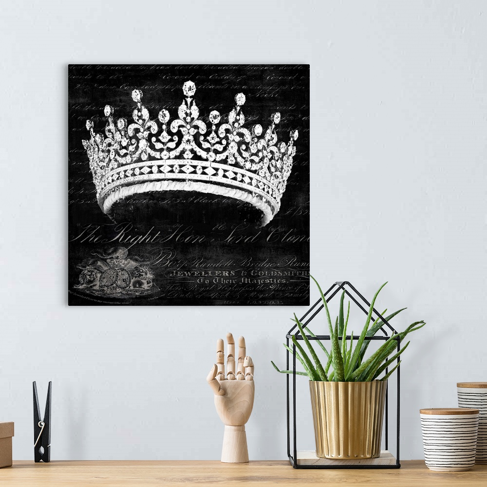 A bohemian room featuring Square decor with a silver crown in the foreground and white script on the black background.