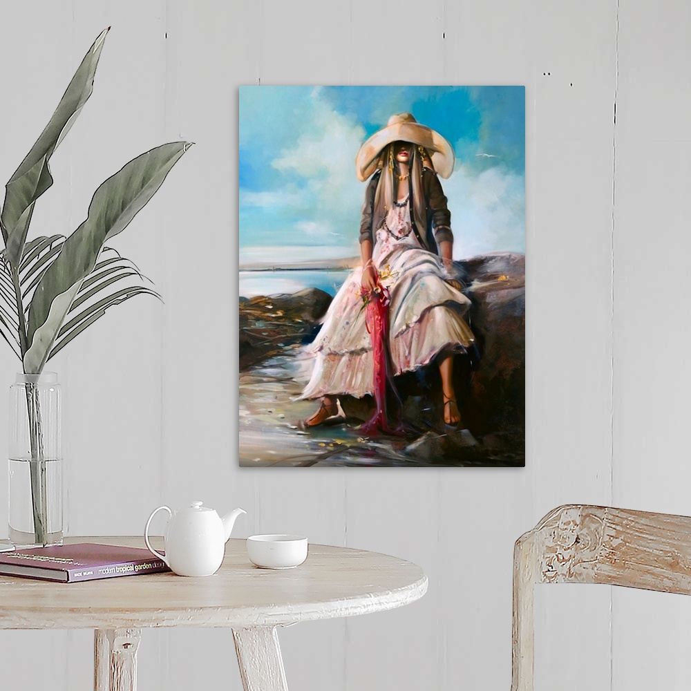 A farmhouse room featuring Painting of a woman in a large hat, relaxing on a rock, at the beach.