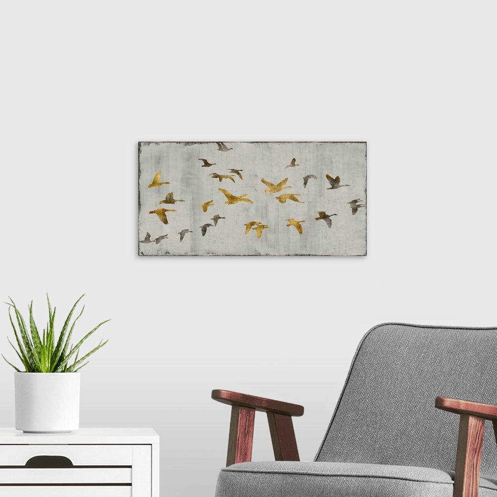 A modern room featuring Large decor with gold and silver birds in flight on a silver textured background.