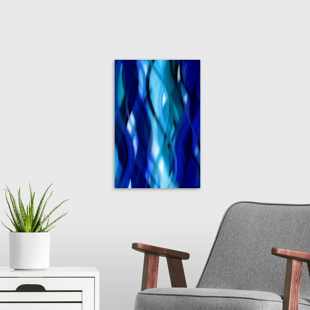 A modern room featuring Abstract art with blurred, wavy ribbons running vertically along the canvas from top to bottom in...