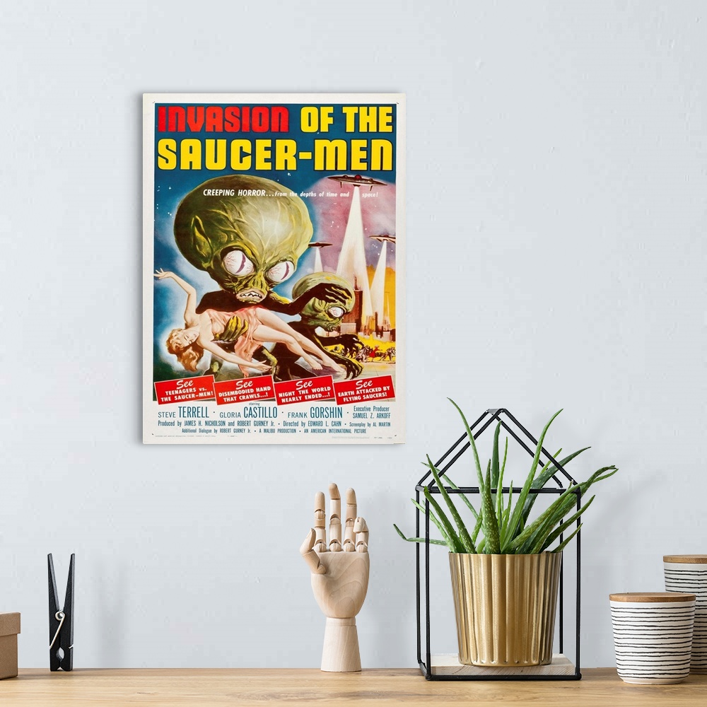 A bohemian room featuring Vintage movie poster for "Invasion Of The Saucer Men".