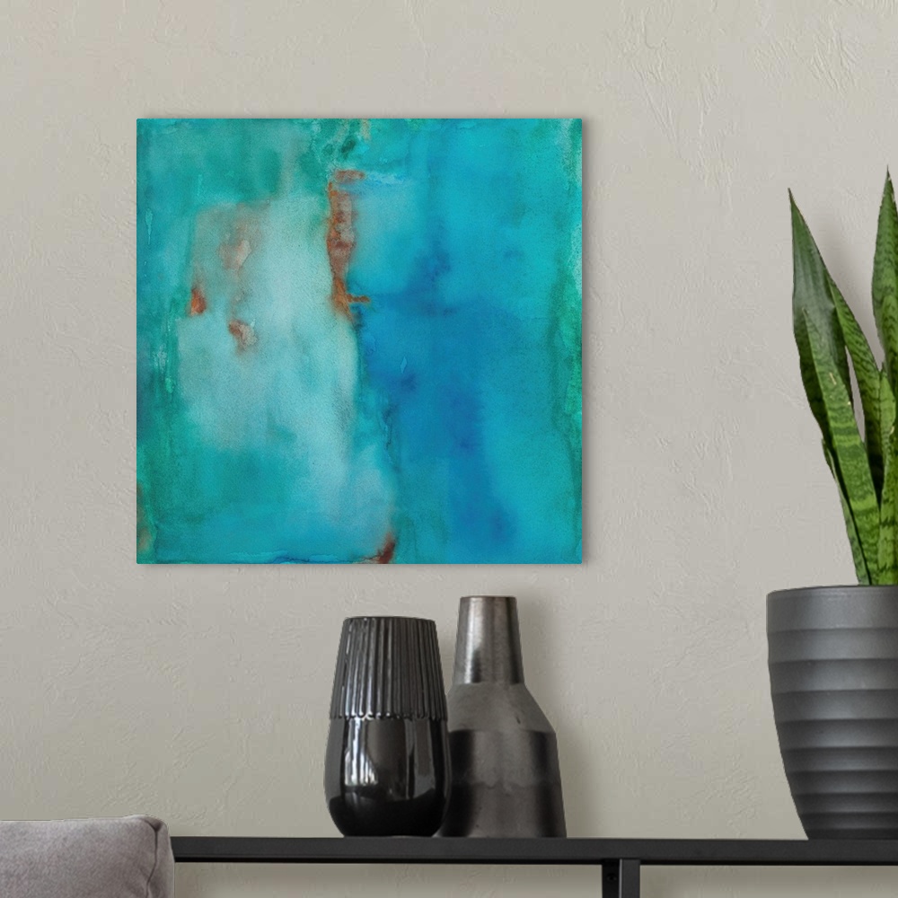 A modern room featuring Square abstract painting in shades of blue with hints of orange.