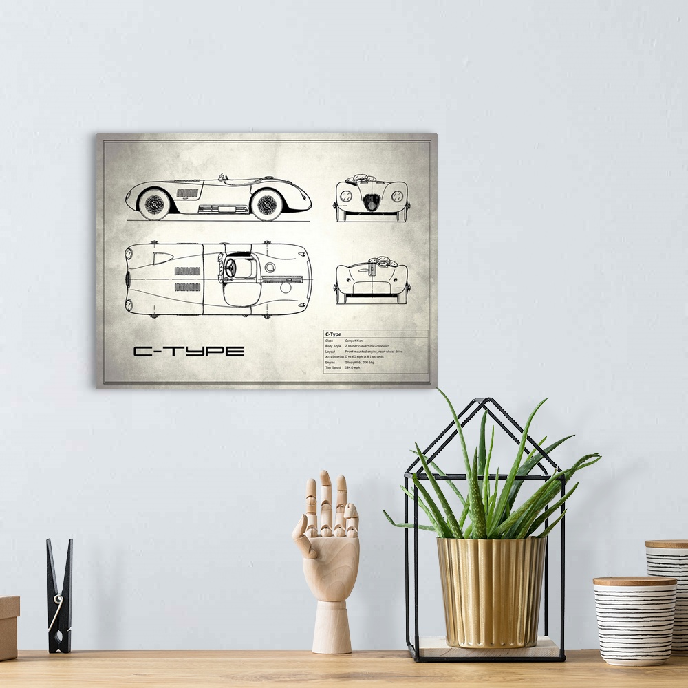 A bohemian room featuring Antique style blueprint diagram of a Jaguar C Type printed on a weathered white and gray background.