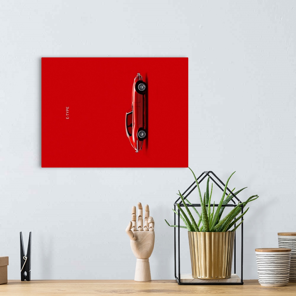 A bohemian room featuring Photograph of a red Jaguar E Type printed on a red background