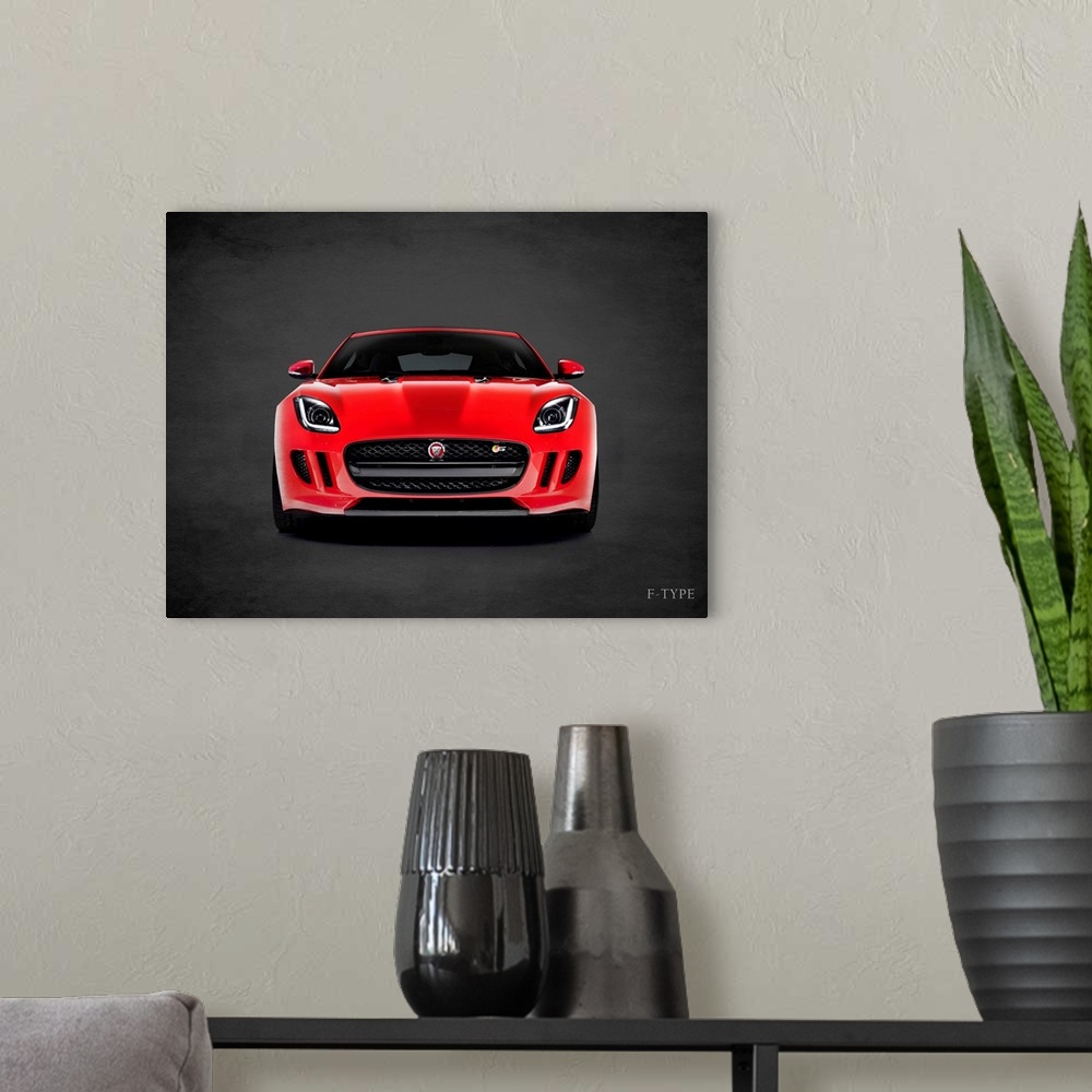 A modern room featuring Photograph of a red Jaguar F-Type  printed on a black background with a dark vignette.