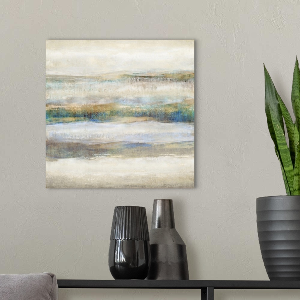 A modern room featuring Square abstract painting with neutral colors and pops of blue and gold running horizontally acros...