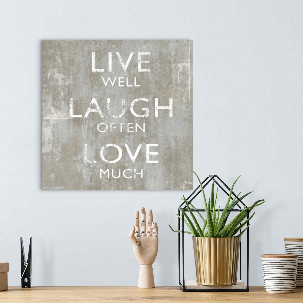 A bohemian room featuring "Live Well Laugh Often Love Much"