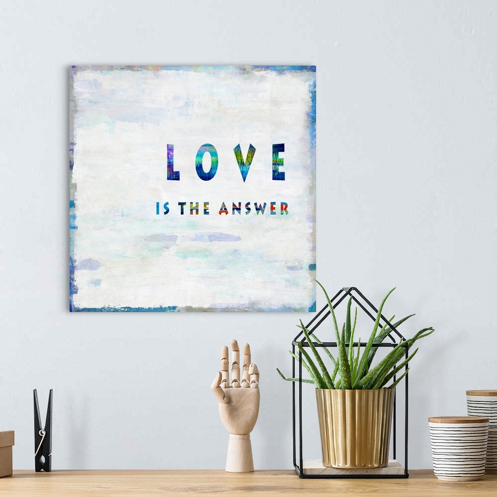 A bohemian room featuring "Love is the Answer"