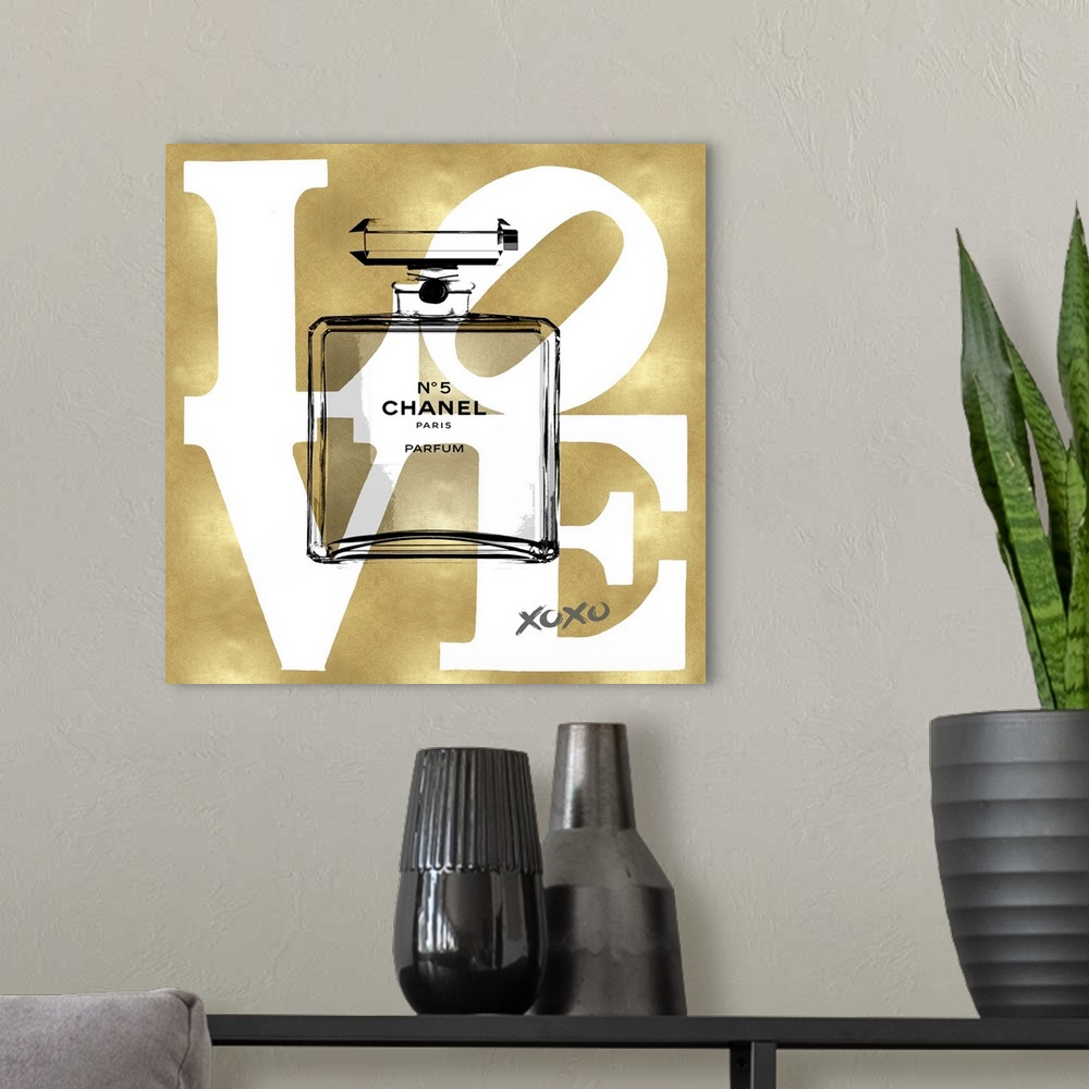A modern room featuring A transparent bottle of perfume sits over a background with the word: Love.