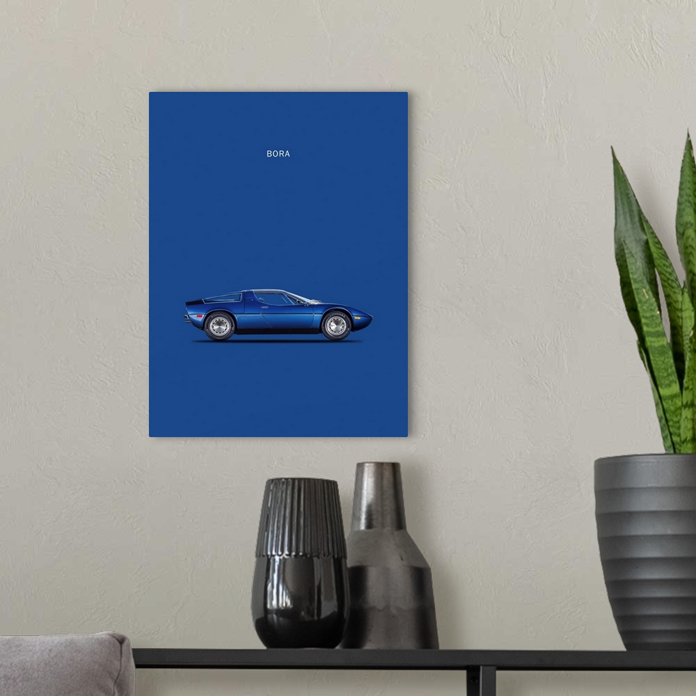 A modern room featuring Photograph of a blue Maserati Bora 1973 printed on a blue background