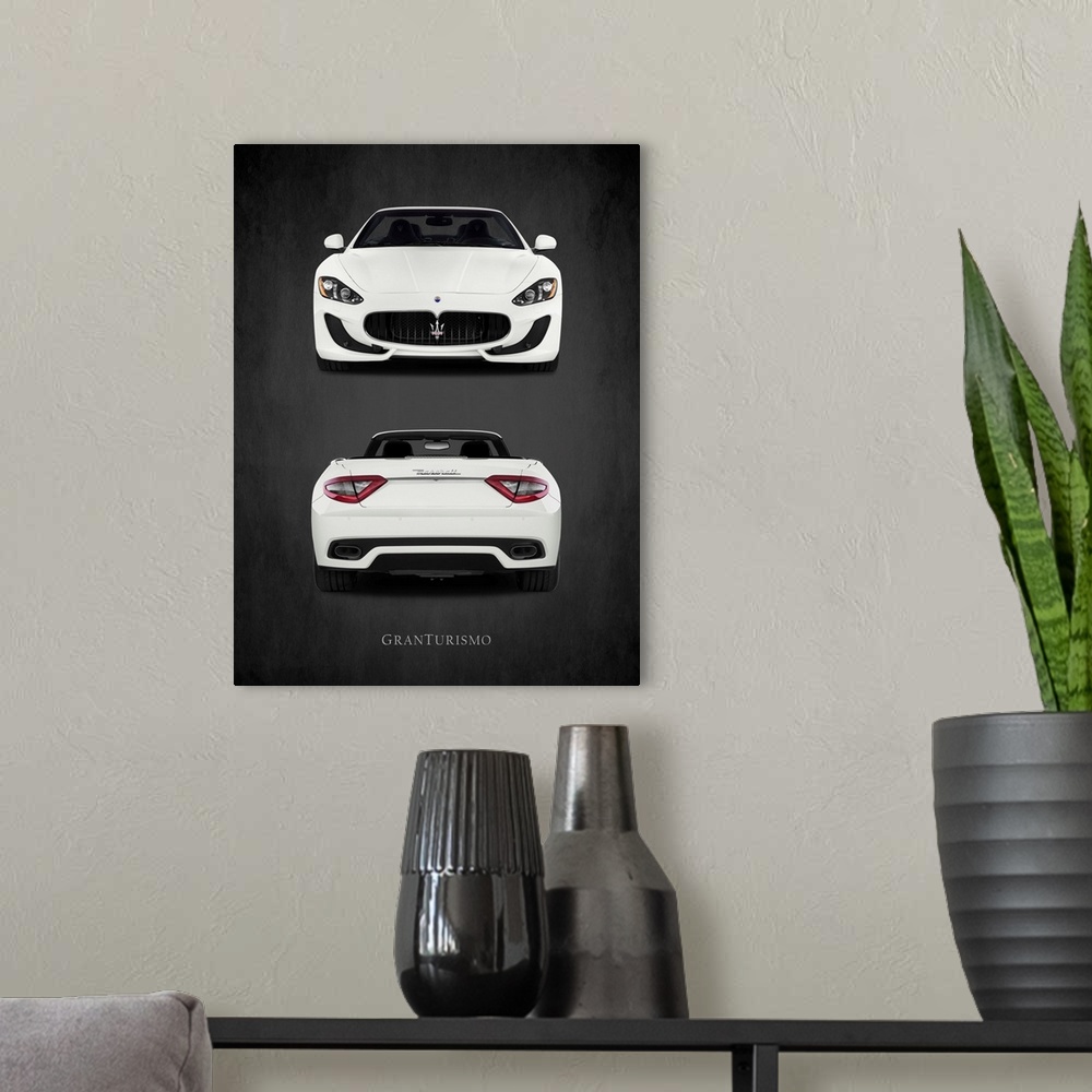 A modern room featuring Photograph of the front and back of a white Maserati GranTurismo printed on a black background wi...