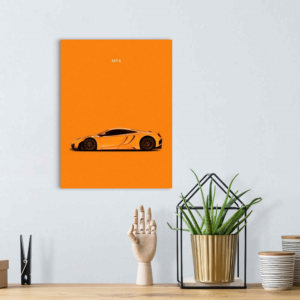 A bohemian room featuring Photograph of an orange McLaren MP4 printed on an orange background