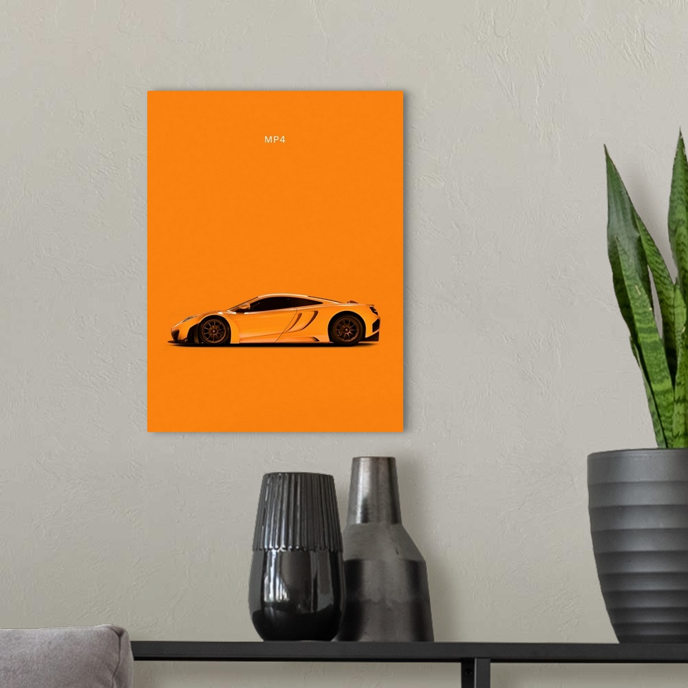 A modern room featuring Photograph of an orange McLaren MP4 printed on an orange background