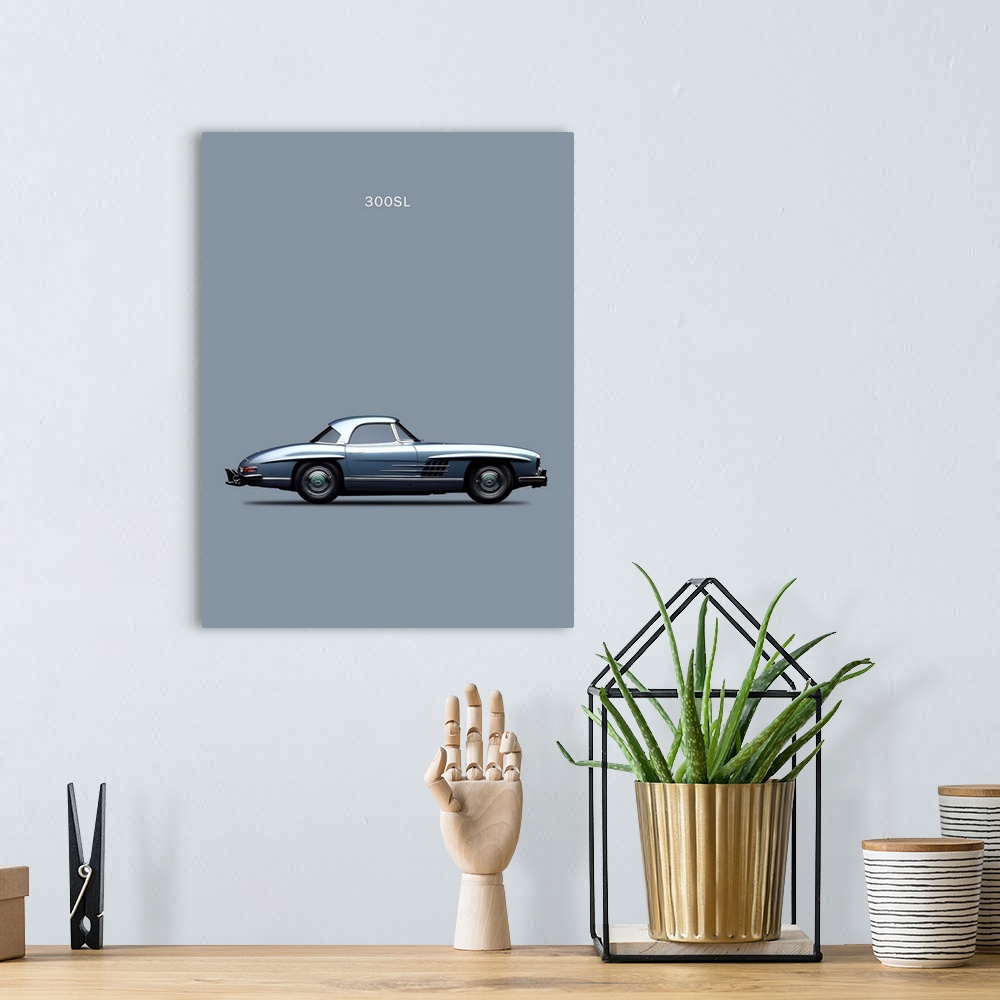 A bohemian room featuring Photograph of a gray Mercedes 300SL 1960 printed on a gray background