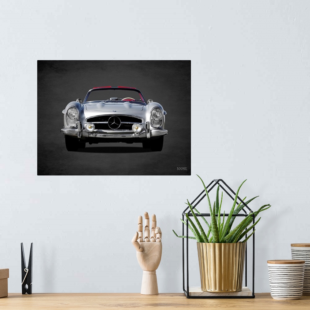 A bohemian room featuring Photograph of a silver 1958 Mercedes Benz 300SL printed on a black background with a dark vignette.