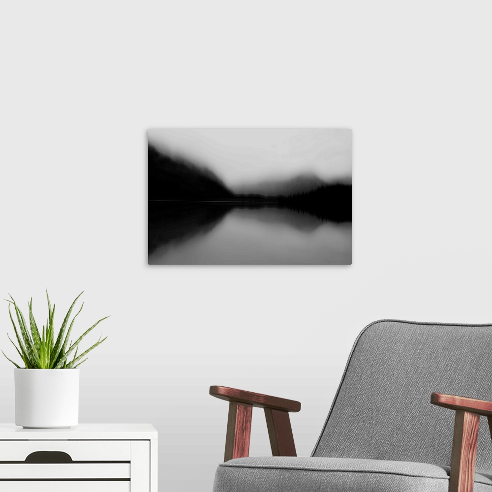 A modern room featuring Contemporary artwork of a lake view landscape as a blurred silhouette.