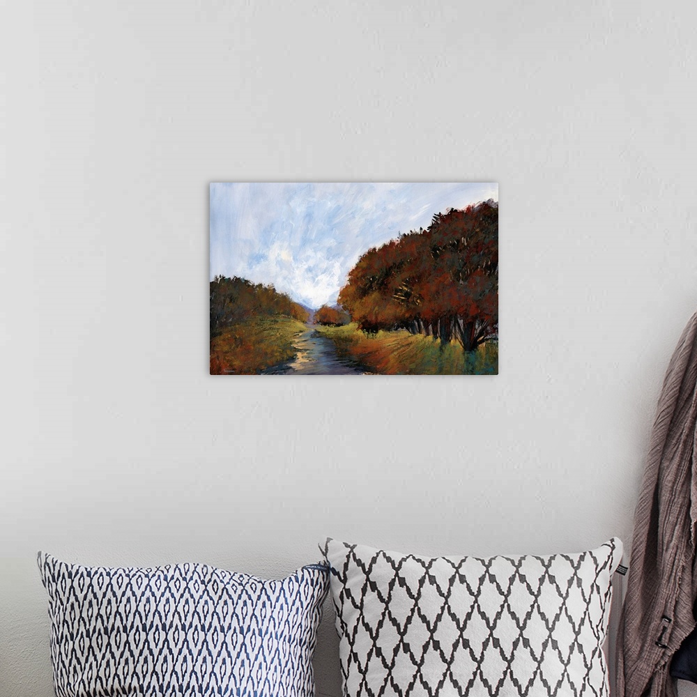 A bohemian room featuring Contemporary painting of a semi-abstract landscape created in Autumn colors.