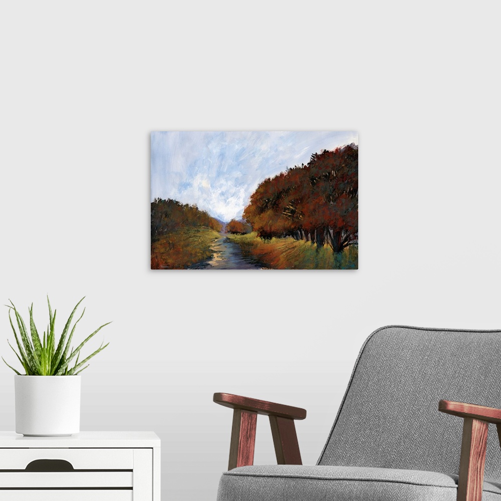 A modern room featuring Contemporary painting of a semi-abstract landscape created in Autumn colors.
