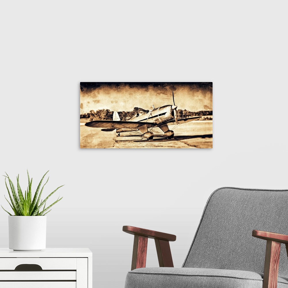 A modern room featuring A distressed photograph of an antique airplane.
