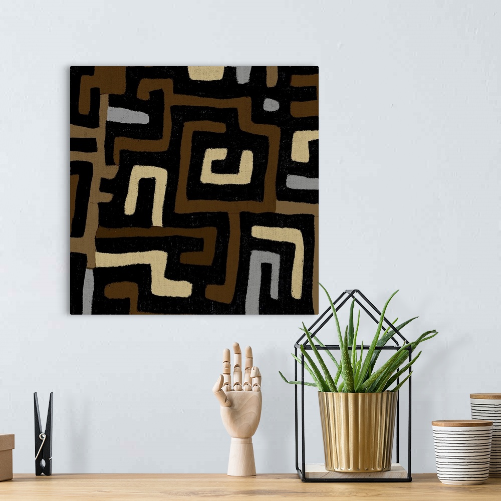 A bohemian room featuring Square abstract art created with patterned brown, tan, and gray lines.