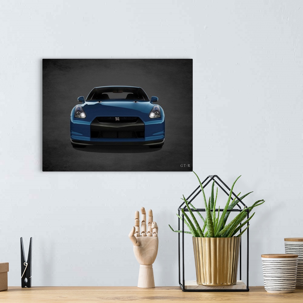 A bohemian room featuring Photograph of a blue Niassn GT-R printed on a black background with a dark vignette.