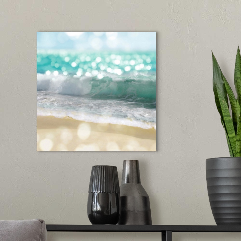A modern room featuring Square photograph of beach waves and the shore with a bokeh effect.
