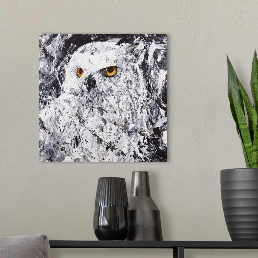 A modern room featuring Square painting of an owl in black and white with gold eyes and abstract style brushstrokes.