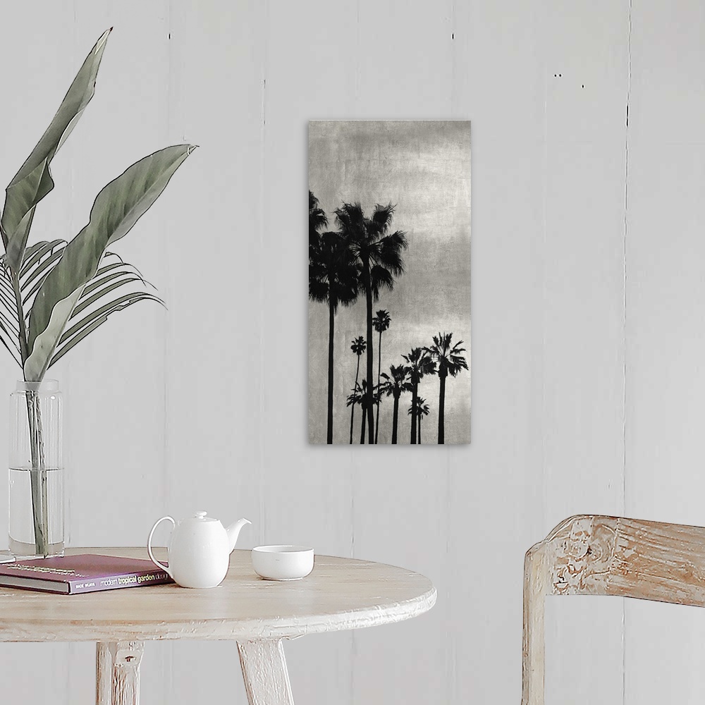 A farmhouse room featuring Decorative artwork featuring a black silhouette of a palm tree over a distressed background.