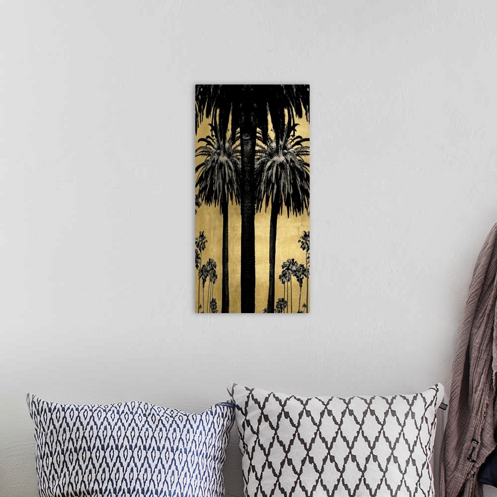 A bohemian room featuring Decorative artwork featuring a black silhouette of palm trees over a distressed background.