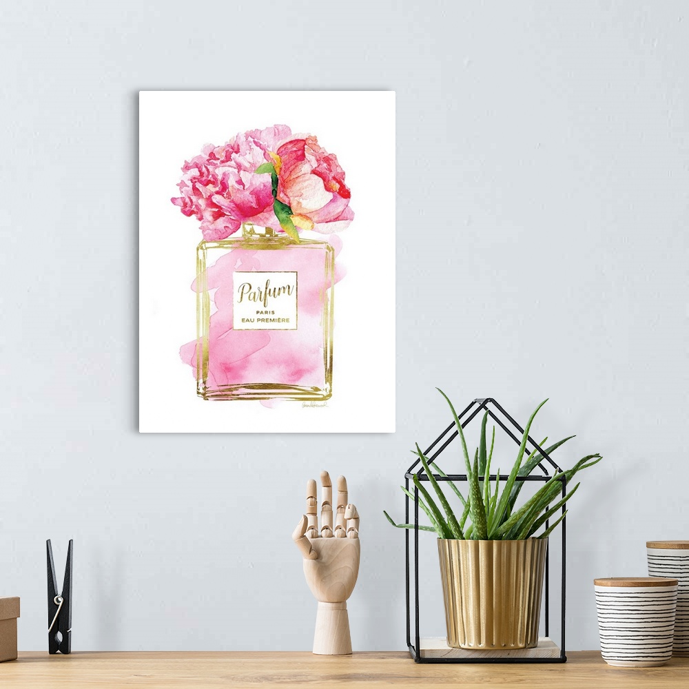 A bohemian room featuring A bottle of perfume filled with watercolor droplets and flowers as the topper.